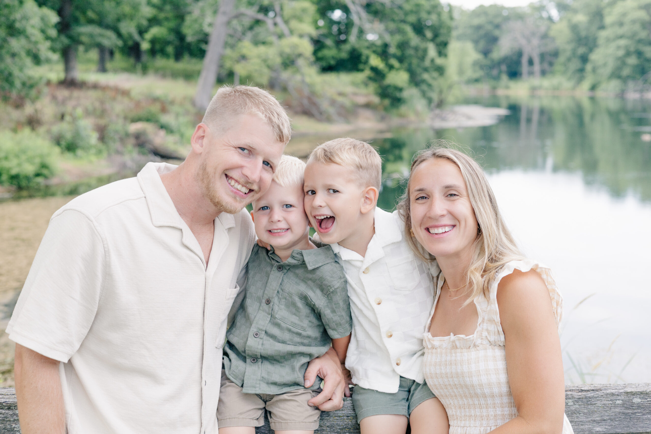Relaxed family portrait in Chicago suburbs with candid smiles and coordinated outfits